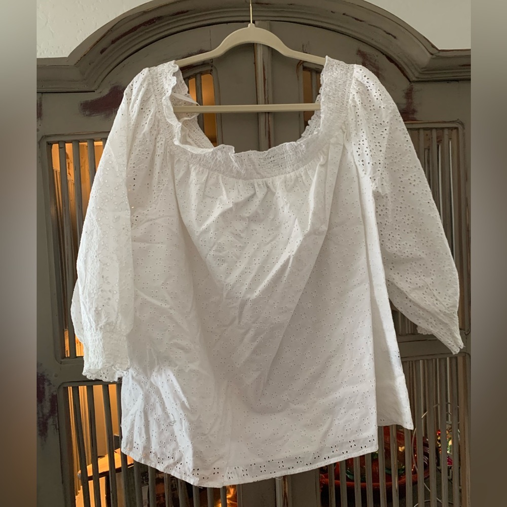 White eyelet off the shoulder shirt.